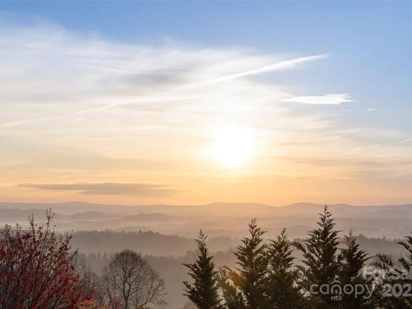 301 Governors Drive, Hendersonville, NC 28791.  MLS# CAR4251149, YatesRealty ID 10194. Morning Sunrise from the deck