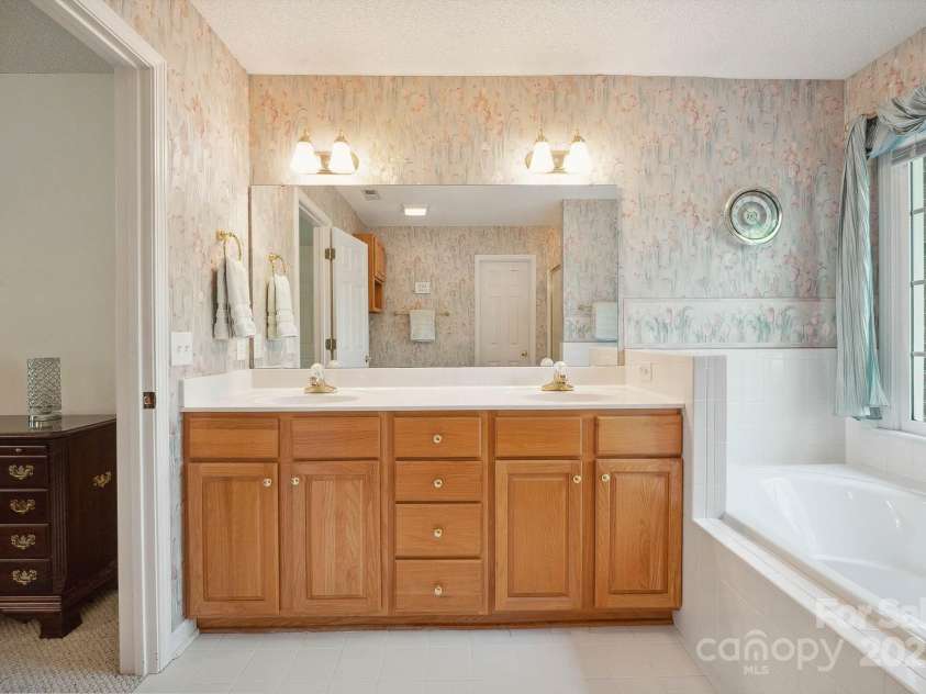 210 35th Avenue, Hickory, NC 28601.  MLS# CAR4245350, YatesRealty ID 10200. Dual Sink Vanity, Tile Floors, & Walk-in Closet