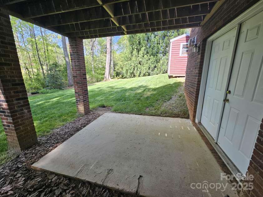 210 35th Avenue, Hickory, NC 28601.  MLS# CAR4245350, YatesRealty ID 10200. Patio off Bsmt Utility Room