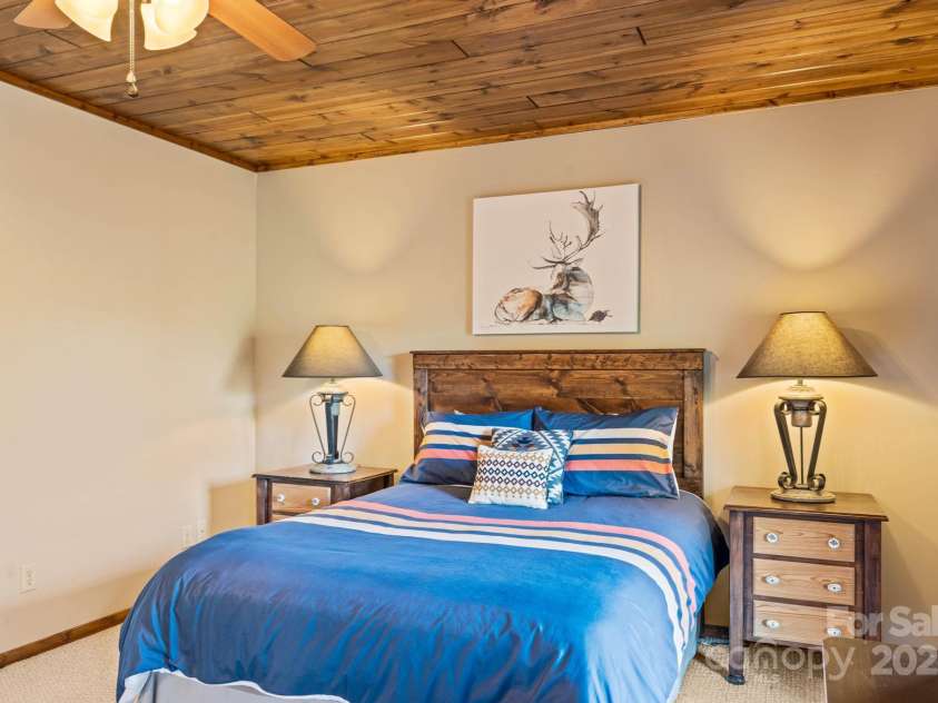 1760 Buck Mountain Road, Purlear, NC 28665.  MLS# CAR4254402, YatesRealty ID 10220. Lower Level Primary Bedroom with Ensuite Bathroom