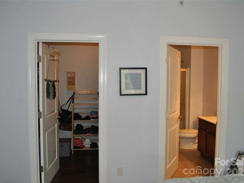 20 Foxden Drive, Fletcher, NC 28732.  MLS# CAR4266872, YatesRealty ID 10222. Primary BR closet on left and bathroom on right