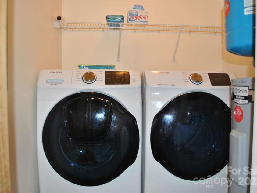 20 Foxden Drive, Fletcher, NC 28732.  MLS# CAR4266872, YatesRealty ID 10222. Washer/dryer off kitchen convey