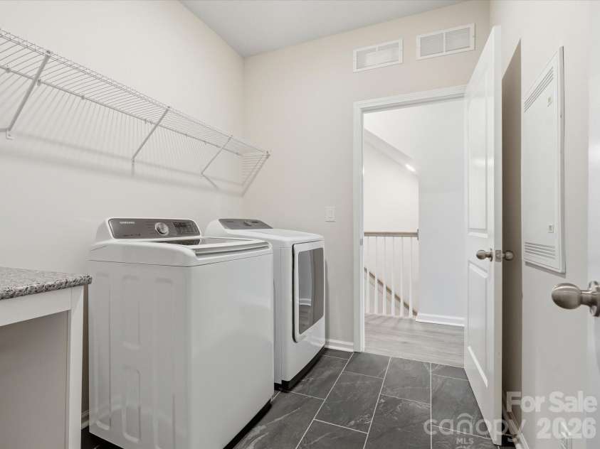 8018 Houser Street, Cornelius, NC 28031.  MLS# CAR4321846, YatesRealty ID 10235. Jack and Jill style laundry opens from the primary bathroom