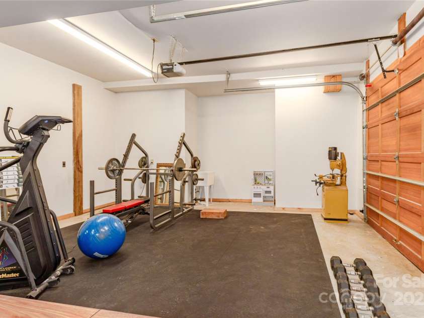 950 Black Forest Drive, Marion, NC 28752.  MLS# CAR4217616, YatesRealty ID 1025. Lower level garage / workout space