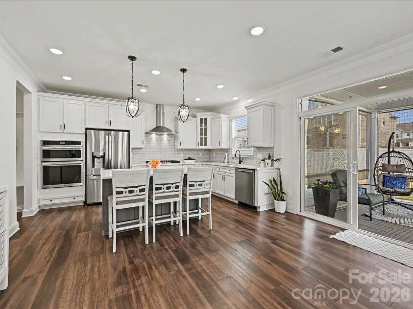 108 Old Field Road, Statesville, NC 28677.  MLS# CAR4360995, YatesRealty ID 10252. Stunning gourmet kitchen featuring a large island with seating, stainless steel appliances, subway tile backsplash, and bright open layout perfect for cooking and entertaining.