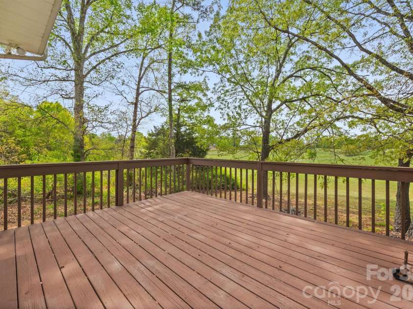 3209 Stump Lake Drive, Monroe, NC 28110.  MLS# CAR4350800, YatesRealty ID 10255. Back deck overlooking serene views