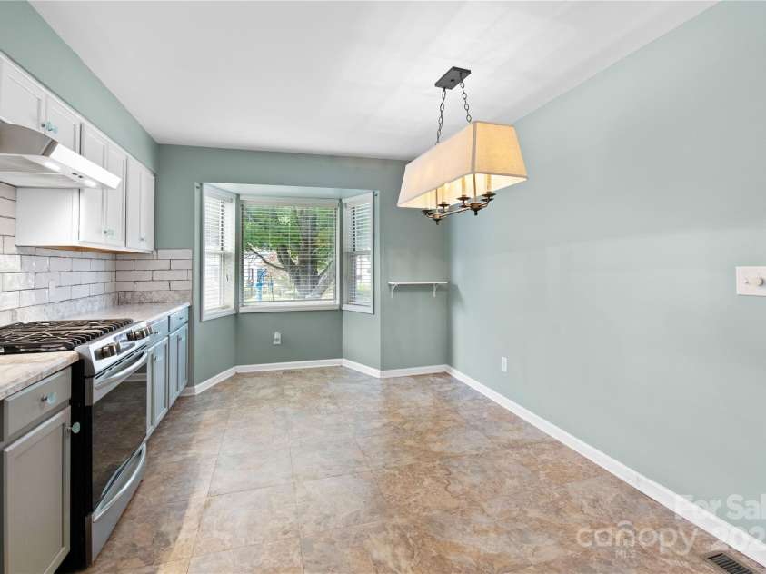 129 Exeter Court, Hendersonville, NC 28791.  MLS# CAR4299063, YatesRealty ID 10256. Ballard’s light fixture