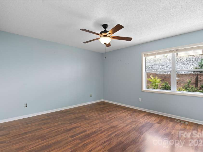 129 Exeter Court, Hendersonville, NC 28791.  MLS# CAR4299063, YatesRealty ID 10256. Primary with garden view