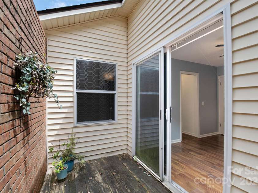 129 Exeter Court, Hendersonville, NC 28791.  MLS# CAR4299063, YatesRealty ID 10256. Private patio