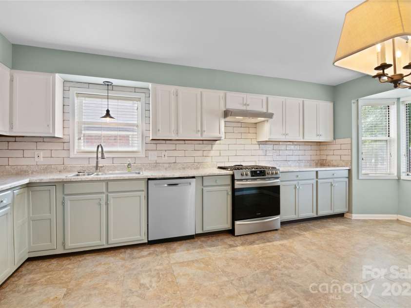 129 Exeter Court, Hendersonville, NC 28791.  MLS# CAR4299063, YatesRealty ID 10256. Renvovated kitchen