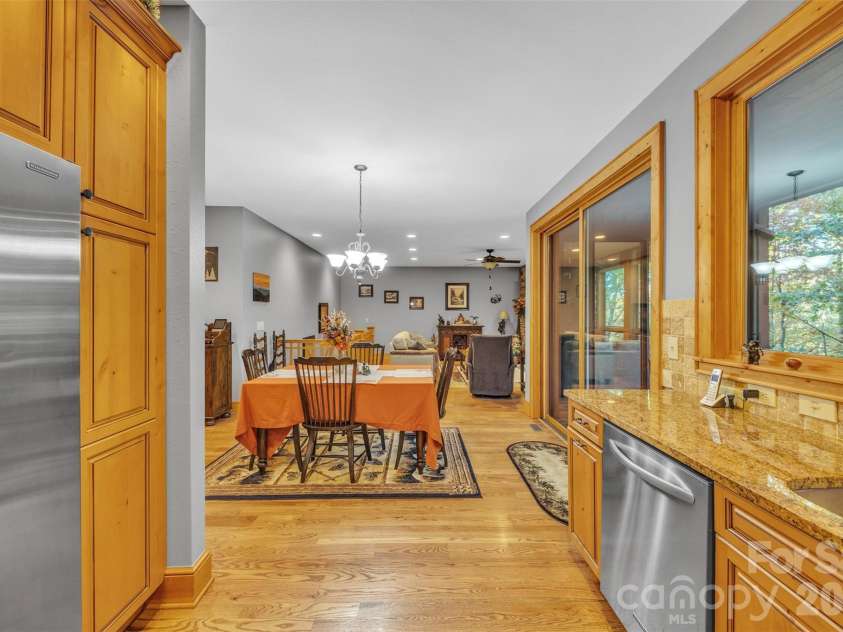 89 Springhouse Drive, Elk Park, NC 28622.  MLS# CAR4310955, YatesRealty ID 10258. From Kitchen to Dining area 