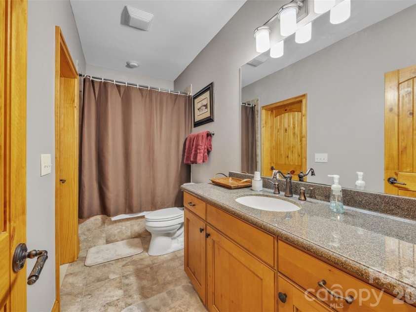 89 Springhouse Drive, Elk Park, NC 28622.  MLS# CAR4310955, YatesRealty ID 10258. Lower-level Bathroom 