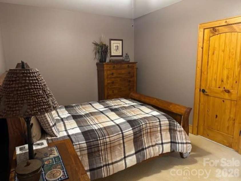 89 Springhouse Drive, Elk Park, NC 28622.  MLS# CAR4310955, YatesRealty ID 10258. Lower-level bedroom