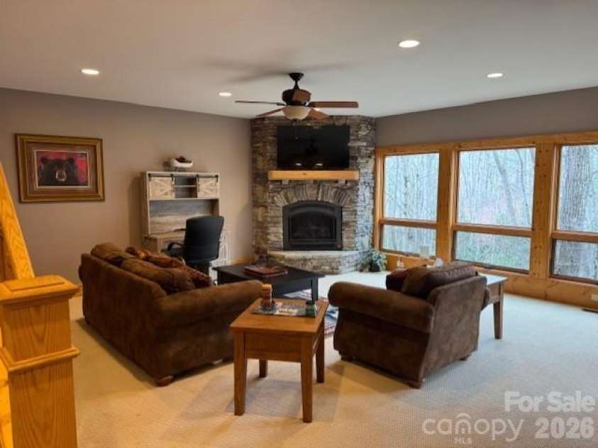 89 Springhouse Drive, Elk Park, NC 28622.  MLS# CAR4310955, YatesRealty ID 10258. Lower-level living-room 