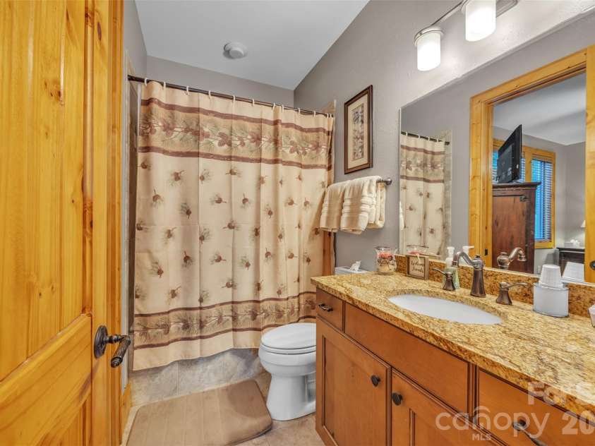 89 Springhouse Drive, Elk Park, NC 28622.  MLS# CAR4310955, YatesRealty ID 10258. Main Floor Guest Bathroom 