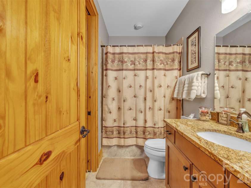 89 Springhouse Drive, Elk Park, NC 28622.  MLS# CAR4310955, YatesRealty ID 10258. Main Floor Guest Bathroom 
