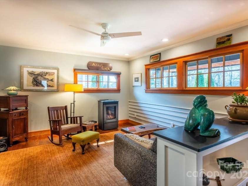 206 West Lane, Brevard, NC 28712.  MLS# CAR4226105, YatesRealty ID 10261. Living room with a vented gas fireplace