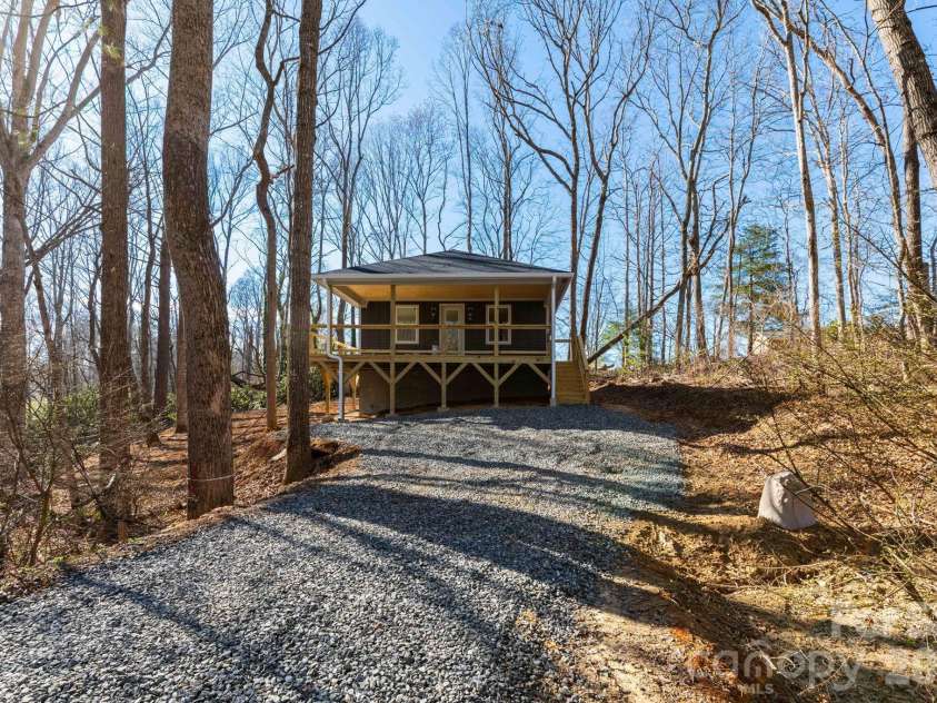 137 Arbutus Trail, Hendersonville, NC 28792.  MLS# CAR4421558, YatesRealty ID 10264. Private and tranquil setting