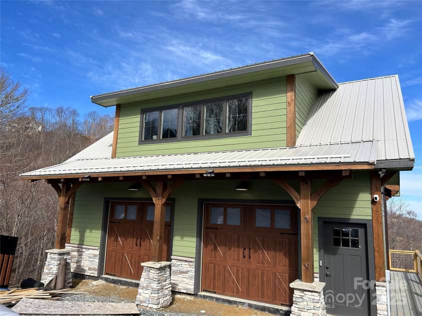 461 Sugar Hill Lane, Sugar Grove, NC 28679.  MLS# CAR4224388, YatesRealty ID 1027. Example of a garage that can be added to the lot to the left of home