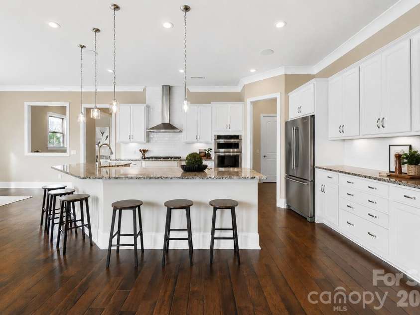 1105 Giacomo Drive, Waxhaw, NC 28173.  MLS# CAR4346410, YatesRealty ID 10275. The gourmet kitchen inspires even more connection with a large center island.