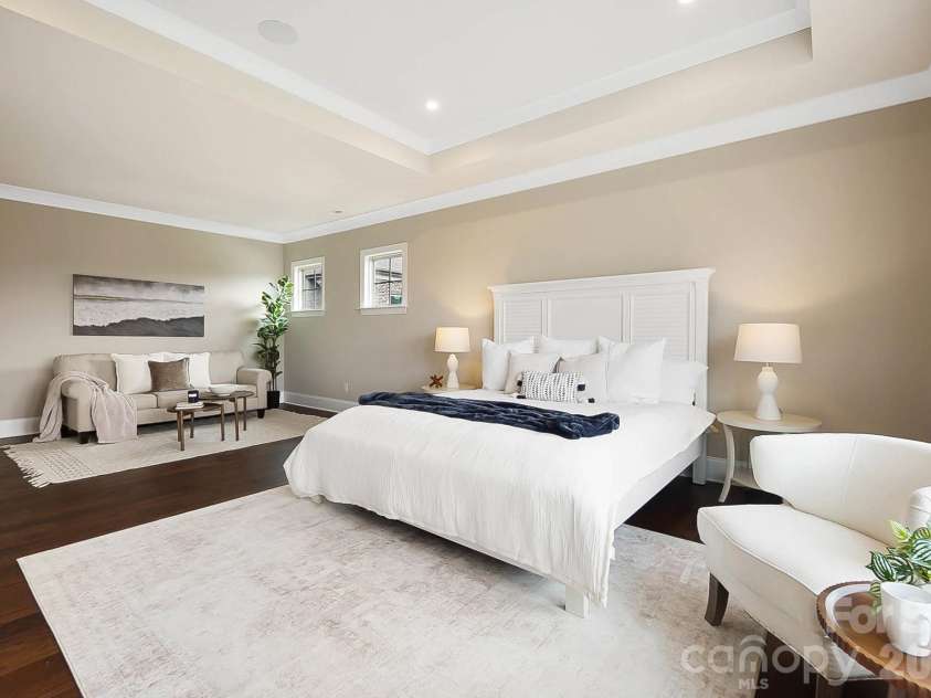 1105 Giacomo Drive, Waxhaw, NC 28173.  MLS# CAR4346410, YatesRealty ID 10275. The luxurious primary retreat features a sitting area & tray ceiling designed for everyday indulgence.