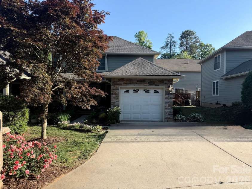 10 Aberdeen Drive, Arden, NC 28704.  MLS# CAR4344820, YatesRealty ID 10276. One car garage with additional parking in front and overflow parking available in the neighborhood