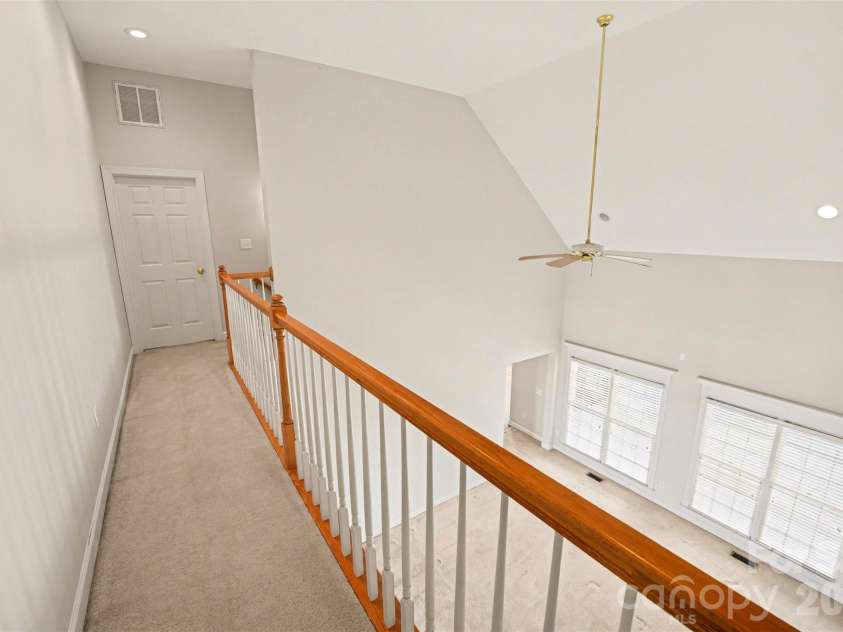 1021 Horse Rock Road, Hickory, NC 28602.  MLS# CAR4350465, YatesRealty ID 10286. Upper level hall features a railing overlooking the great room, creating an open feel
