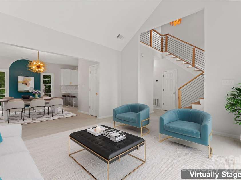 121 Northampton Drive, Mooresville, NC 28117.  MLS# CAR4250579, YatesRealty ID 10286. Virtually staged living room to dining room