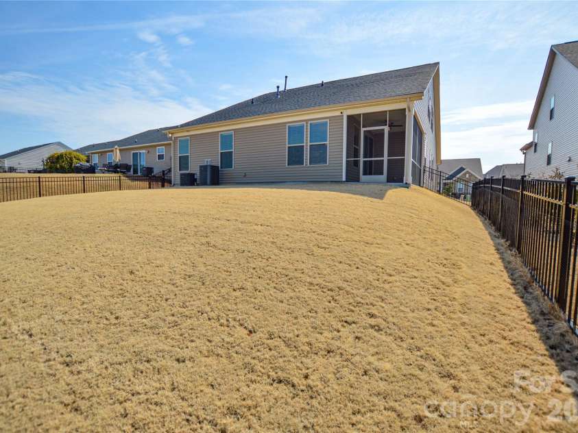 515 Cherry Blossom Avenue, Concord, NC 28027.  MLS# CAR4352090, YatesRealty ID 10288. Fenced in backyard