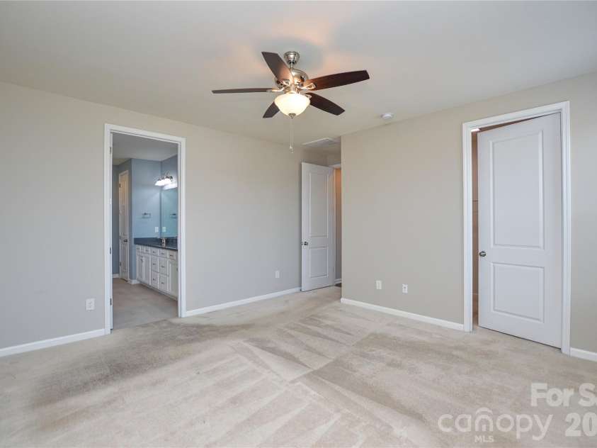 515 Cherry Blossom Avenue, Concord, NC 28027.  MLS# CAR4352090, YatesRealty ID 10288. Main Level Primary Bedroom