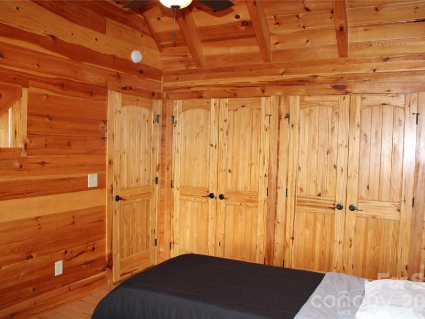 109 Overlook Point Lane, Lake Lure, NC 28746.  MLS# CAR4336925, YatesRealty ID 1029. Bedroom# 2 with a wall of closets