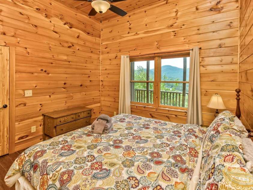 109 Overlook Point Lane, Lake Lure, NC 28746.  MLS# CAR4336925, YatesRealty ID 1029. Bedroom #3 also has high ceilings and views of the lake and mountains