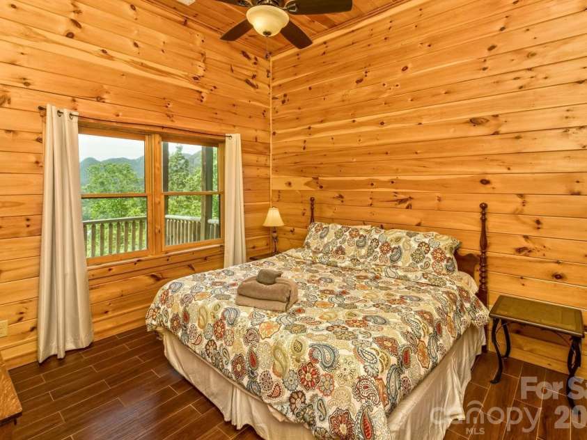 109 Overlook Point Lane, Lake Lure, NC 28746.  MLS# CAR4336925, YatesRealty ID 1029. Bedroom #3 (second Master suite) with ensuite bathroom off Family Room in Lower Level