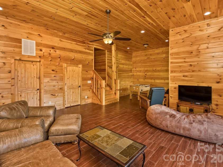 109 Overlook Point Lane, Lake Lure, NC 28746.  MLS# CAR4336925, YatesRealty ID 1029. Lots of natural light and plenty of space for your family to enjoy plus access to a full back deck and porches