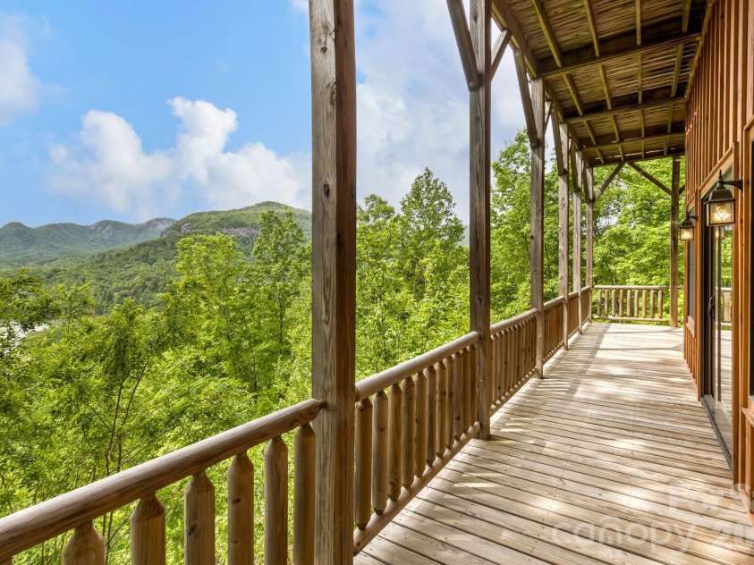 109 Overlook Point Lane, Lake Lure, NC 28746.  MLS# CAR4336925, YatesRealty ID 1029. Lower-level deck and porches facing the views!