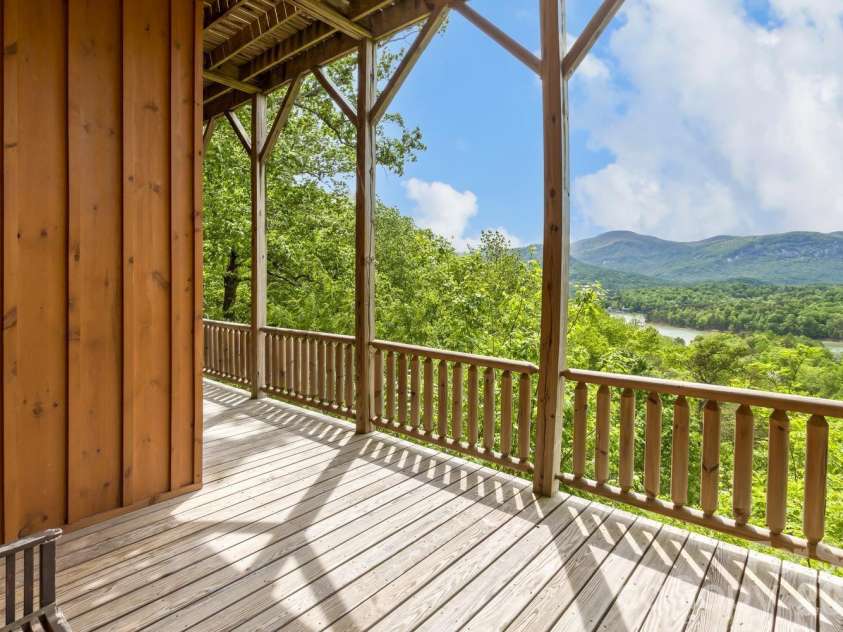 109 Overlook Point Lane, Lake Lure, NC 28746.  MLS# CAR4336925, YatesRealty ID 1029. Lower-level full length deck and porches facing the views