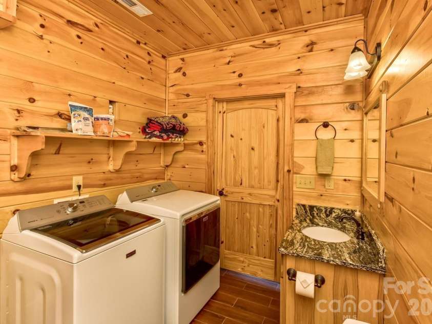 109 Overlook Point Lane, Lake Lure, NC 28746.  MLS# CAR4336925, YatesRealty ID 1029. Lower Level Half Bath with Laundry and storage closet