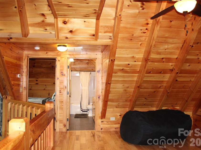 109 Overlook Point Lane, Lake Lure, NC 28746.  MLS# CAR4336925, YatesRealty ID 1029. Upper Level Open Loft leads to the Bonus Room, Full Bathroom #2 and Bedroom#2