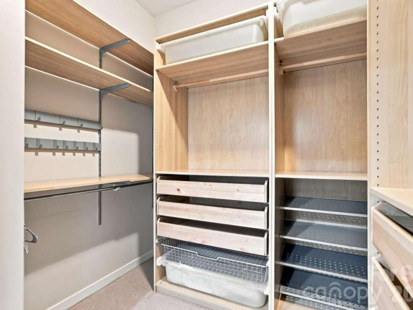 2125 Southend Drive, Charlotte, NC 28203.  MLS# CAR4415556, YatesRealty ID 10291. Custom closet system maximizes storage with built-in drawers, shelving and hanging space.