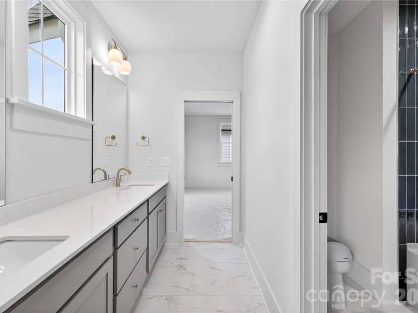 7237 Westrow Avenue, Charlotte, NC 28278.  MLS# CAR4311743, YatesRealty ID 1030. Bath #2 Offers Dual vanity with beautiful upgraded tile shower.