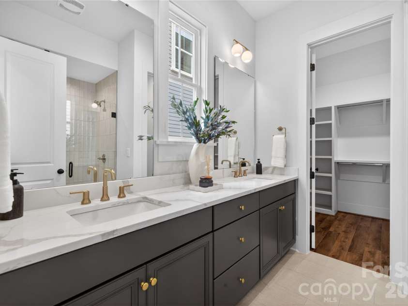 7237 Westrow Avenue, Charlotte, NC 28278.  MLS# CAR4311743, YatesRealty ID 1030. Beautiful primary bath offers dual vanity, abundant storage and large zero entry tile shower.