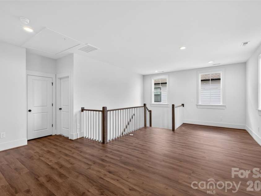 7237 Westrow Avenue, Charlotte, NC 28278.  MLS# CAR4311743, YatesRealty ID 1030. Fun flowing second floor loft space with open railing.