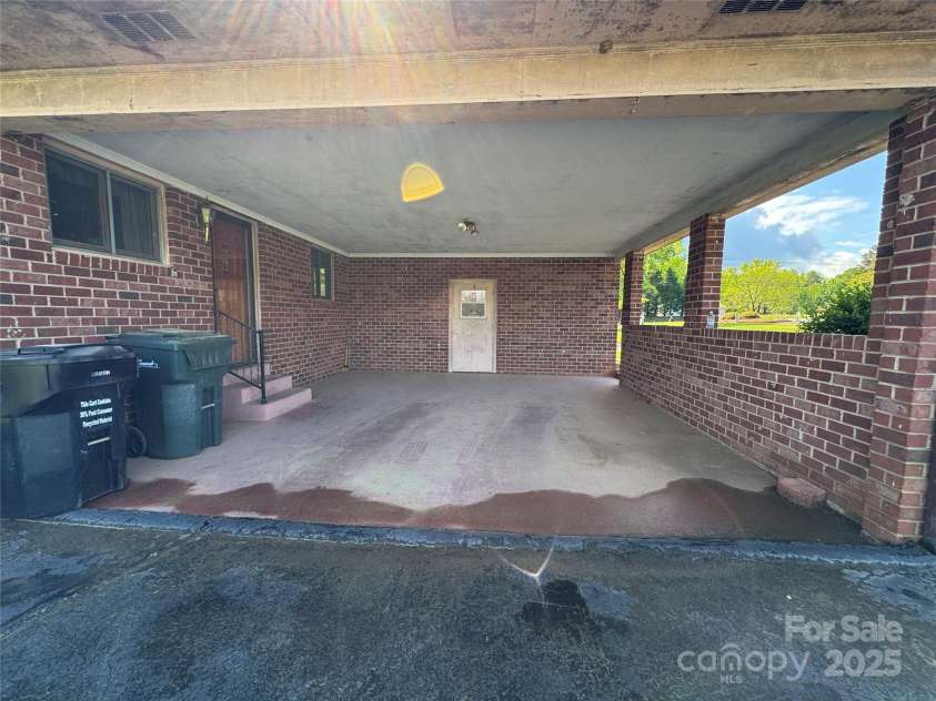 1012 Burrage Road, Concord, NC 28025.  MLS# CAR4247416, YatesRealty ID 10307. Carport with utility room