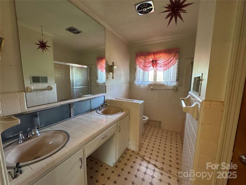 1012 Burrage Road, Concord, NC 28025.  MLS# CAR4247416, YatesRealty ID 10307. Hall bath also connected to Bedroom 3