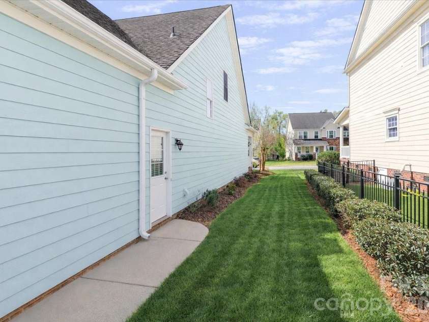 3368 Keady Mill Loop, Kannapolis, NC 28081.  MLS# CAR4357702, YatesRealty ID 10307. More side yard leading to back of home