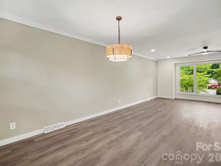 5324 Cheval Place, Charlotte, NC 28205.  MLS# CAR4421359, YatesRealty ID 10317. Dining into living room