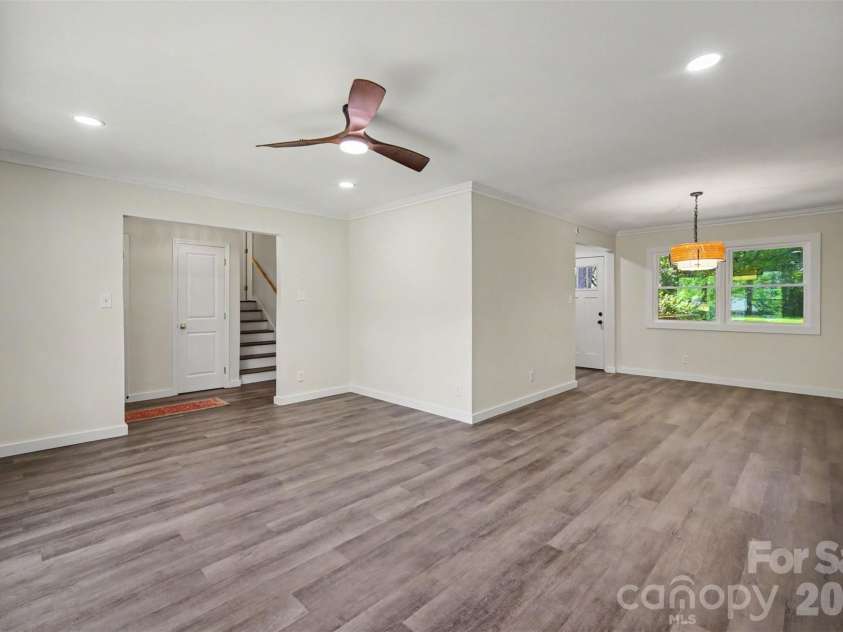 5324 Cheval Place, Charlotte, NC 28205.  MLS# CAR4421359, YatesRealty ID 10317. Living room into dining