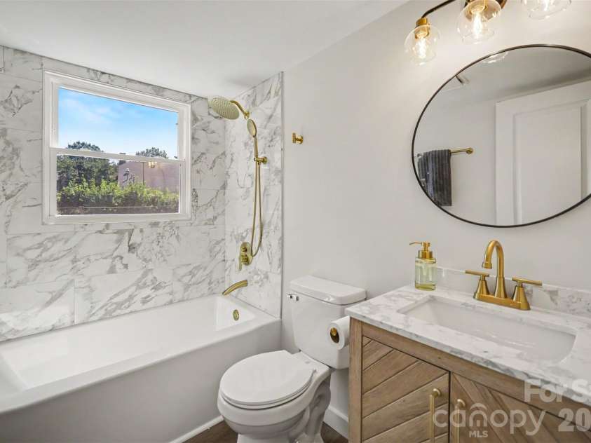 5324 Cheval Place, Charlotte, NC 28205.  MLS# CAR4421359, YatesRealty ID 10317. Lower level bathroom