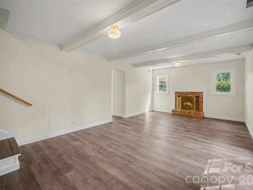 5324 Cheval Place, Charlotte, NC 28205.  MLS# CAR4421359, YatesRealty ID 10317. Lower level bedroom staged as private office