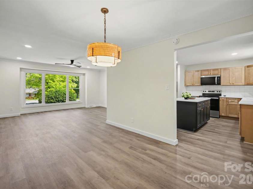 5324 Cheval Place, Charlotte, NC 28205.  MLS# CAR4421359, YatesRealty ID 10317. Open living dining and kitchen on main level